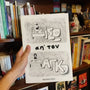 "Πίσω απ' τον Πάγκο" comic book held in hand for size reference.