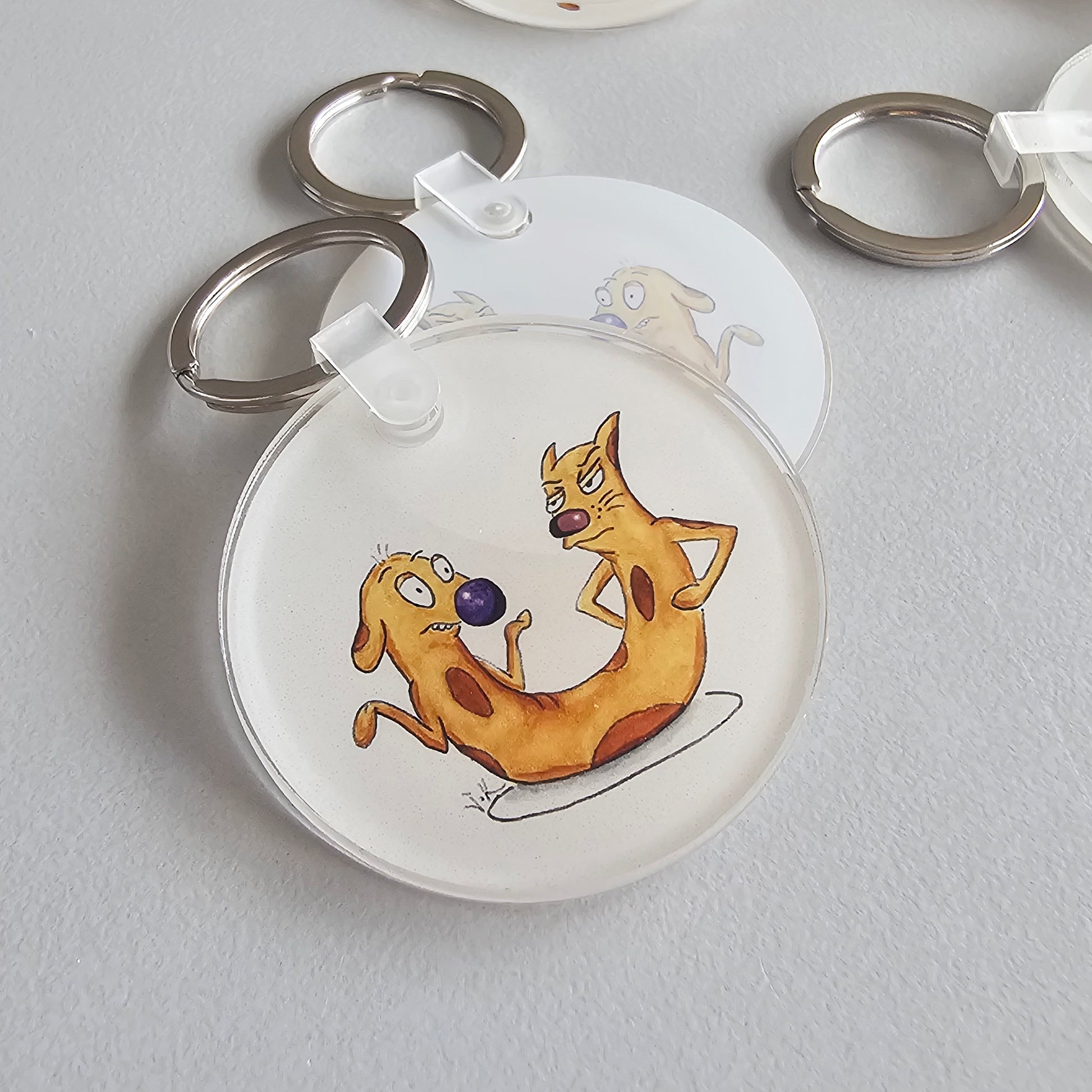 Close-up of the Cat-ch Me If You Can acrylic keychain by Sketch Stories.