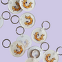 Flat lay of Cat-ch Me If You Can acrylic keychains by Sketch Stories.
