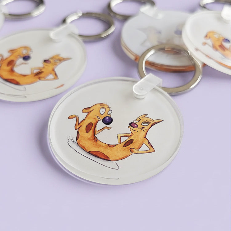 Acrylic keychain with the hand-drawn "Cat-ch Me If You Can" design by Sketch Stories.