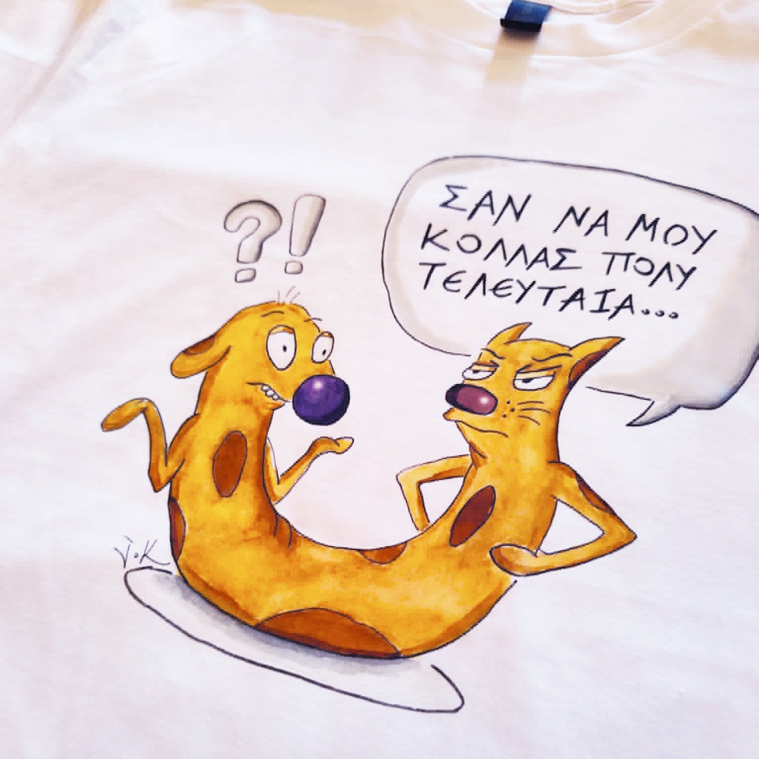 Close-up of the hand-drawn "Cat-ch me if you can" illustration printed on a white unisex t-shirt.
