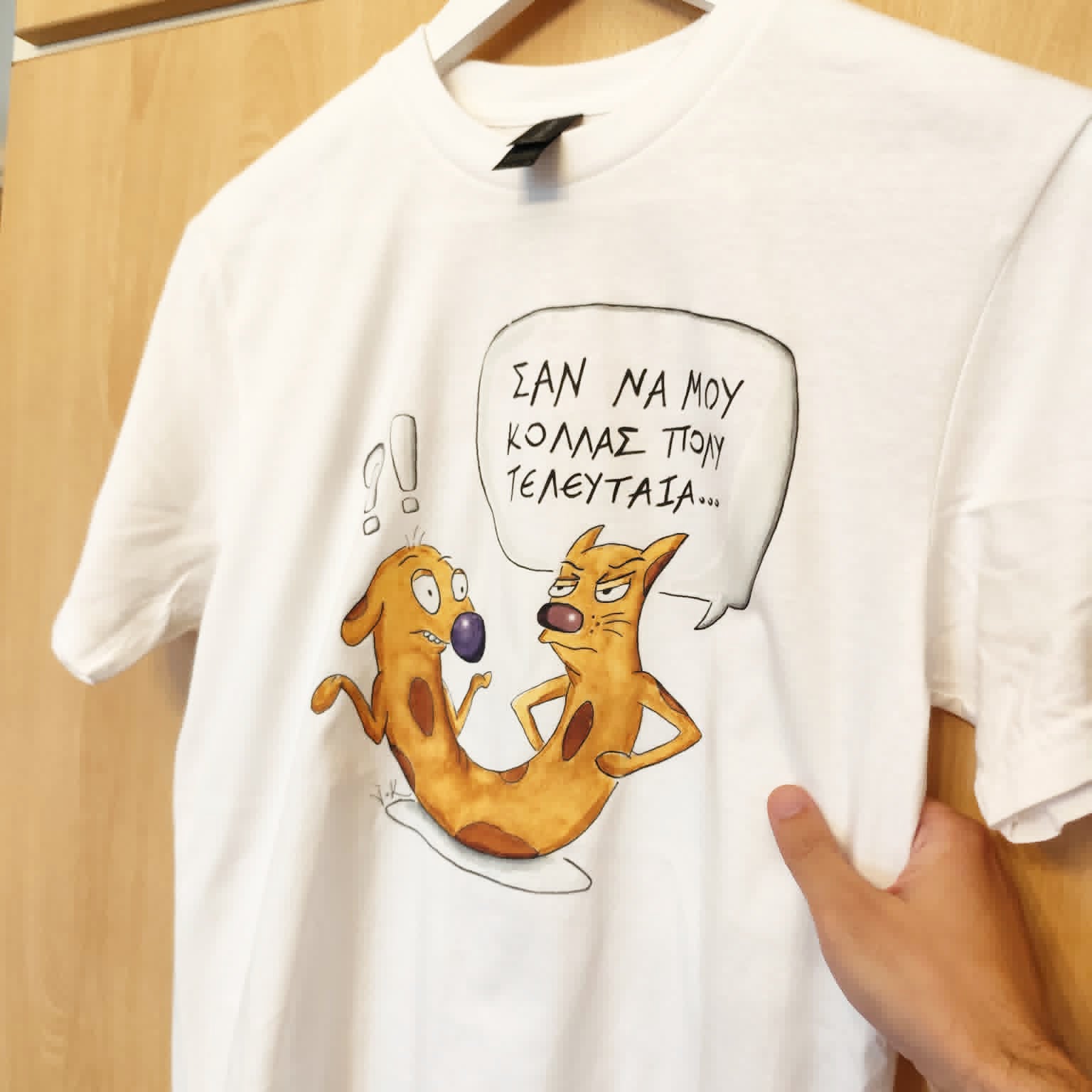 White unisex T-shirt featuring the hand-drawn "Cat-ch Me If You Can" cartoon illustration by Sketch Stories