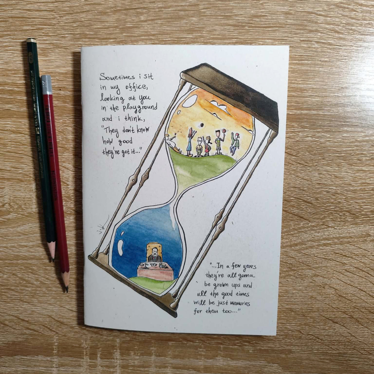 Childhood Memories illustrated notebook displayed on a creative workspace.