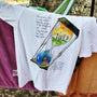 Childhood Memories unisex T-shirt hanging outdoors by Sketch Stories