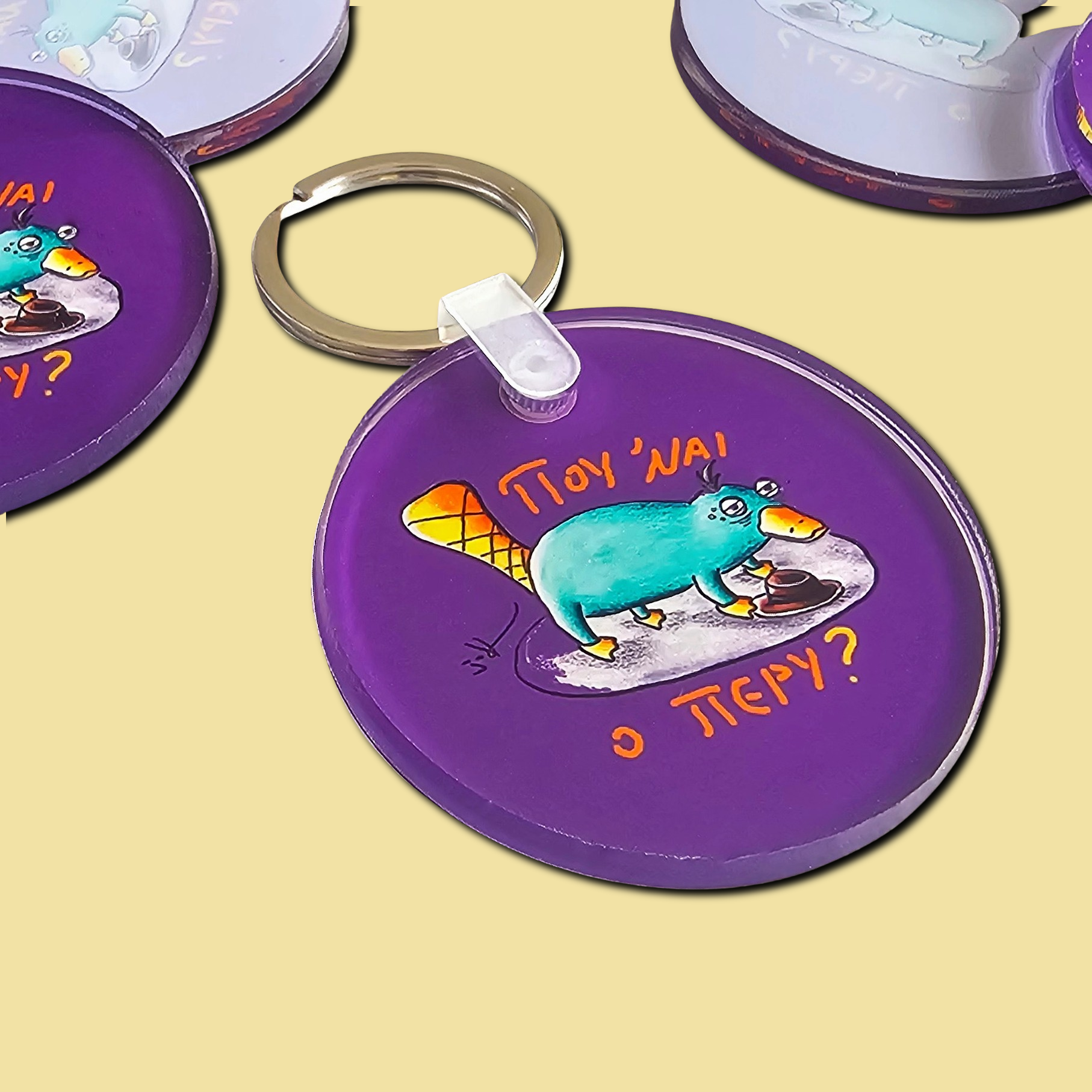 Acrylic keychain with the hand-drawn "Exhausted Spy" design by Sketch Stories.
