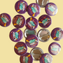 Exhausted Spy illustrated pin button displayed with other illustrated pin buttons by Sketch Stories.