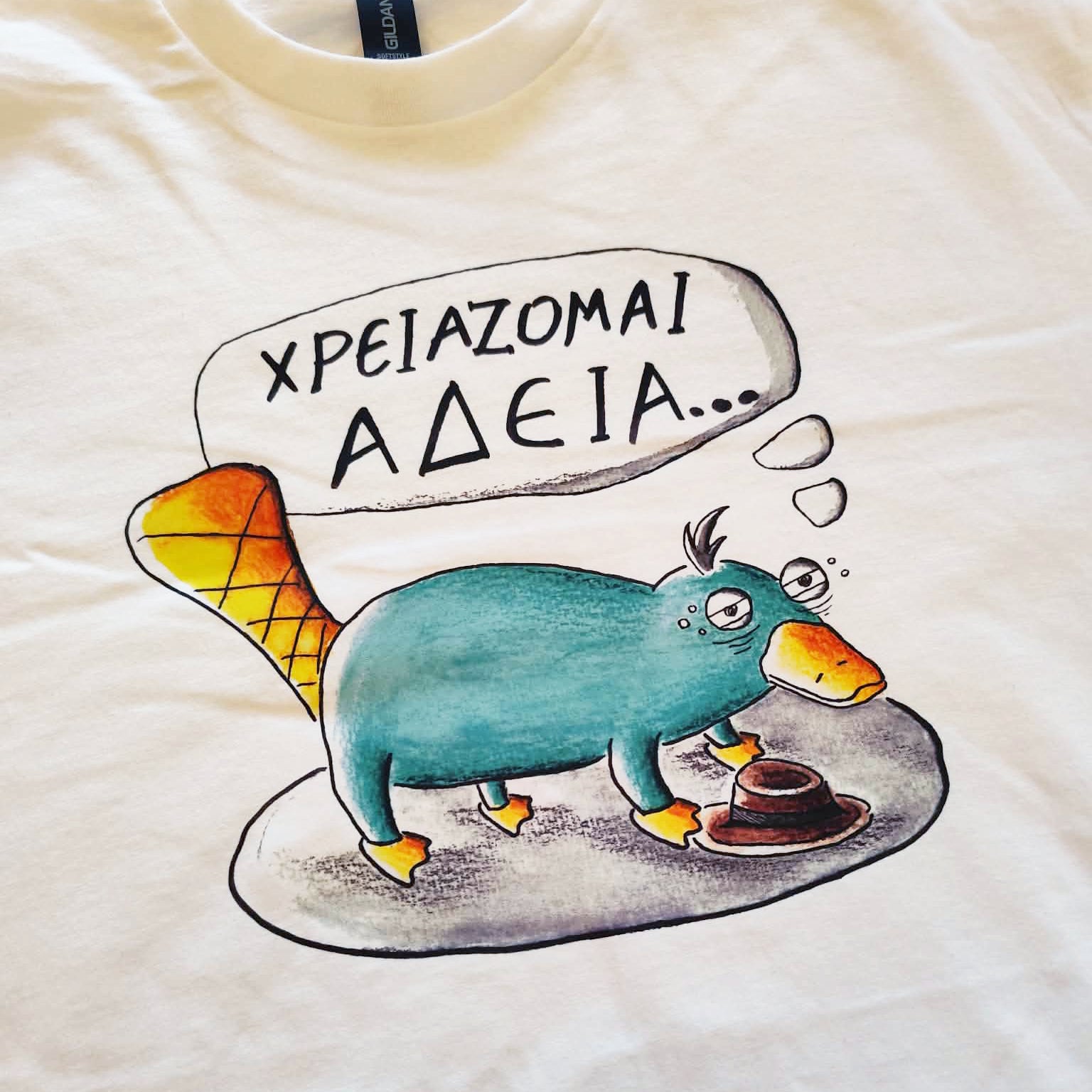 Close-up of the hand-drawn "Exhausted Spy" illustration printed on a white unisex t-shirt.