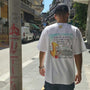 White unisex T-shirt featuring the hand-drawn "Ikarian Dance" cartoon illustration by Sketch Stories