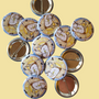Never Grow Up illustrated pin button displayed with other illustrated pin buttons by Sketch Stories.