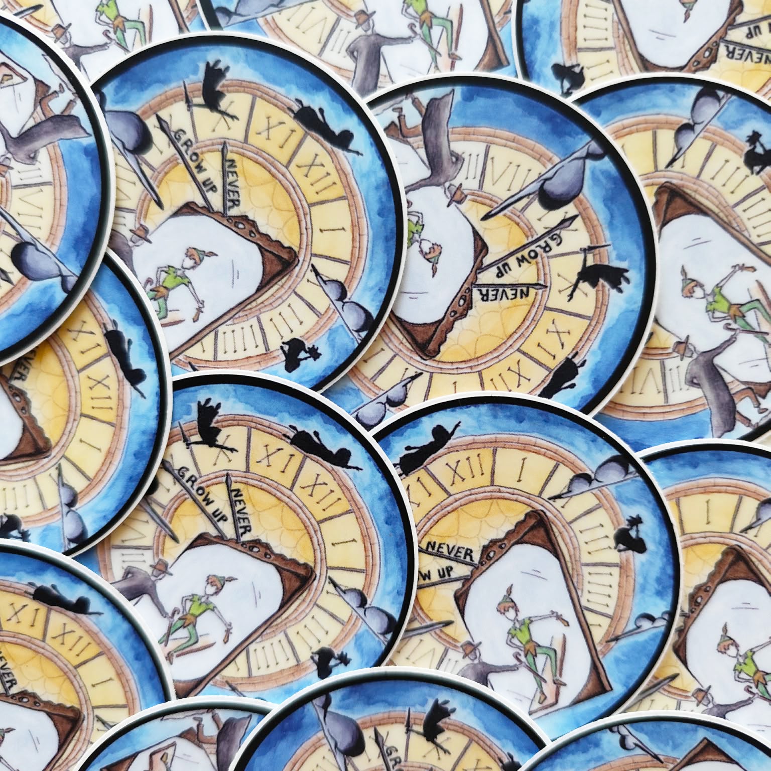 Never Grow Up illustrated vinyl stickers displayed together.