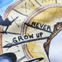 Detailed close-up of the Never Grow Up illustration on a cotton tote bag.