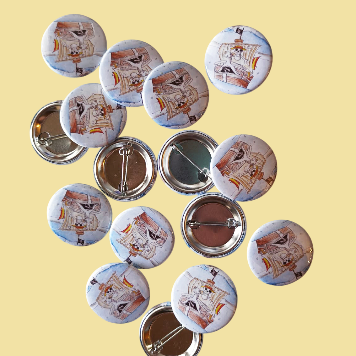 One Ship illustrated pin button displayed with other illustrated pin buttons by Sketch Stories.