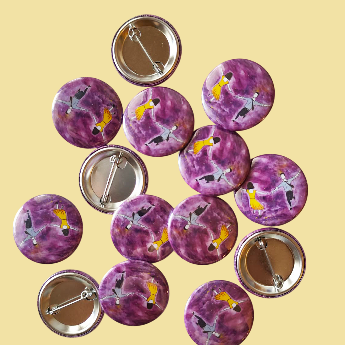Sunset Dance illustrated pin button displayed with other illustrated pin buttons by Sketch Stories.